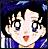 Pixelated character with large eyes and open mouth, wearing blue and white clothing against dark background.