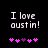 Pixelated text 'I love austin!' in white on black background with pink and purple heart symbols below.
