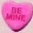 Four heart-shaped candy icons with text: pink 'BE MINE', white 'KISS ME', pink 'I LUV YOU', yellow 'I'M YOURS' on light background.