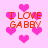 Pixelated pink background with scattered heart shapes and repeated orange text reading "I LOVE GABBY" in four locations.
