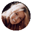 Two circular cropped images of a person with long light brown hair, first smiling with eyes open then with eyes closed and mouth open as if vomiting.