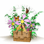A brown woven basket filled with green foliage and pink flowers, containing two wooden sticks crossed over the top, with butterflies fluttering around it.