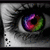 A close-up of a human eye with a rainbow-colored iris, showing subtle animation changes