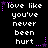 Pixelated text displays "love like you've never been hurt" in white with purple stars on black background, arranged in two of three identical