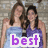 Two women in blue and purple dresses stand together against a stone background with text overlays.