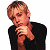 A pixelated image of a person with light brown hair wearing a black shirt, positioned next to green text on a dark background.