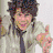Four distinct views of a person with dark curly hair in different outfits and backgrounds, including one view with pink text.