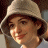 A pixelated image of a person wearing a light-colored wide-brimmed hat, with green text reading 'Original Icons .com' on the right side.