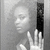 Black-and-white image of a person with raised hand, showing subtle facial expression changes across frames.