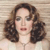 Static pixelated image of a person with shoulder-length brown hair, light skin, and closed eyes against a striped background.