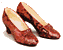 Red high-heeled shoes with light beige insoles arranged in a , some frames showing yellow starbursts over the shoes