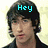 A four- shows a person with dark hair and a black jacket against a light background, with pixelated text changing