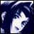 A pixelated anime-style character face with blue hair and white highlights on a dark background, next to stylized text reading "Anime IM" and "com" in a retro digital font.