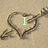 Heart-shaped sand drawing with arrow, displaying sequential text: 'I', then 'Love', then partial 'Cath' on light brown background.