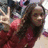 A person in a red top makes a peace sign with their right hand, with red text overlays changing between frames.