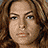 A 48x48 pixel animated contact sheet showing three sequential frames of a woman with long brown hair in different poses and settings, including holding a microphone and kissing another person.