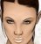Pixelated close-up of a person's face with dark hair, light skin tone, and neutral expression against white background.