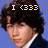 A four- shows a person with dark curly hair in a blue suit and white shirt against a solid background, with yellow text changing