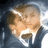 Pixelated image of two people embracing with text labels and date below, blue pixelated font on white background.