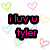 Pixelated heart-shaped patterns in pastel colors surround pink text reading 'iluvu tyler' on a white background with gray corner.