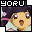 Pixelated character with dark hair and light skin, wearing a light green shirt with pink accents, mouth open in a surprised expression, surrounded by pink and purple floral background elements.
