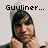 Pixelated image of a person with dark hair holding hands near their face, overlaid with black text reading 'Gyuliner... Vork it pete' on a light background.