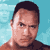 Pixelated static image of a person's face with short dark hair against a light blue background, rendered in low-resolution 8-bit style typical of early internet icons.