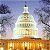 Static pixelated image of a domed building with golden base against cloudy sky background.