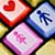 Three pixelated icons with floral and heart motifs on a gradient background, featuring red, blue, and pink color schemes.