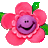 Pixelated pink flower with purple center featuring a smiling face, green leaves on left and right sides against gray background.