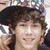 Four- shows a person with brown curly hair in different poses and backgrounds, including one with purple text reading "Nick Jonas" and a heart symbol