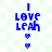 Blue pixelated text "I LOVE LEAH" with two heart symbols on a light green and white checkered background, animated to alternate between one or two hearts below the text.