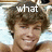 A pixelated image of a person with brown hair lying on a light blue surface, with text overlays changing across frames.
