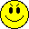 Four yellow pixelated smiley faces arranged in a on gray background, each with distinct facial features and expressions