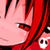 Pixelated close-up of a character with red hair and pink skin, featuring visible facial features including eyes and mouth, with a small skull symbol in the corner.