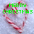 A heart-shaped arrangement of red-and-white striped candy canes on a light gray background with green pixelated text reading "MERRY CHRISTMAS" and "AND A HAPPY NEW YEAR."