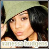 A close-up of a person with long dark hair wearing a light green hat, with text reading 'vanessa hudgens' at the bottom.