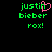 Green pixelated text 'justin bieber rox!' on black background with pink heart replacing the letter 'i' in 'justin'.
