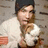 A pixelated image shows a person holding a white dog against a brick wall, with cyan text reading 'Pete', 'Rocks My', and 'Socks' on a black background.