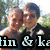 Two people in a close embrace with one person's arm around the other, set against an outdoor background.