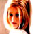 Pixelated static image of a person with reddish-brown hair and light skin tone, cropped to show head and shoulders against a bright background.