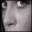 Six- of a person's face showing sequential eye and mouth movements in grayscale with halftone dot pattern