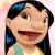 Pixelated cartoon character with dark hair, blue highlights, and a light blue top against a pink background.