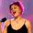 A 2x2 contact sheet of four distinct frames from an animated icon featuring a woman with pink hair, a microphone, and the American Idol logo.
