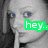 A grayscale image of a person with blue eyes and light hair, featuring green text overlays that change across frames.