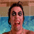 Pixelated image of a person with dark hair and heavy makeup in a pool, with red text reading "Frank's initial reaction_" and "To your face." on a light blue background.