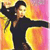 A figure in a black outfit holds a black cat against a gradient background of yellow, orange, and pink hues.