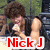 Pixelated image of a person with brown hair in a black jacket holding a white object, with red text 'NickJ' at the bottom.