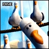 Pixelated image of multiple seagulls perched on a wire with a blue sky background, one seagull prominently in the foreground.