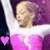 A person in a pink and white outfit with arms raised, shown across four where the leftmost includes a pink heart symbol